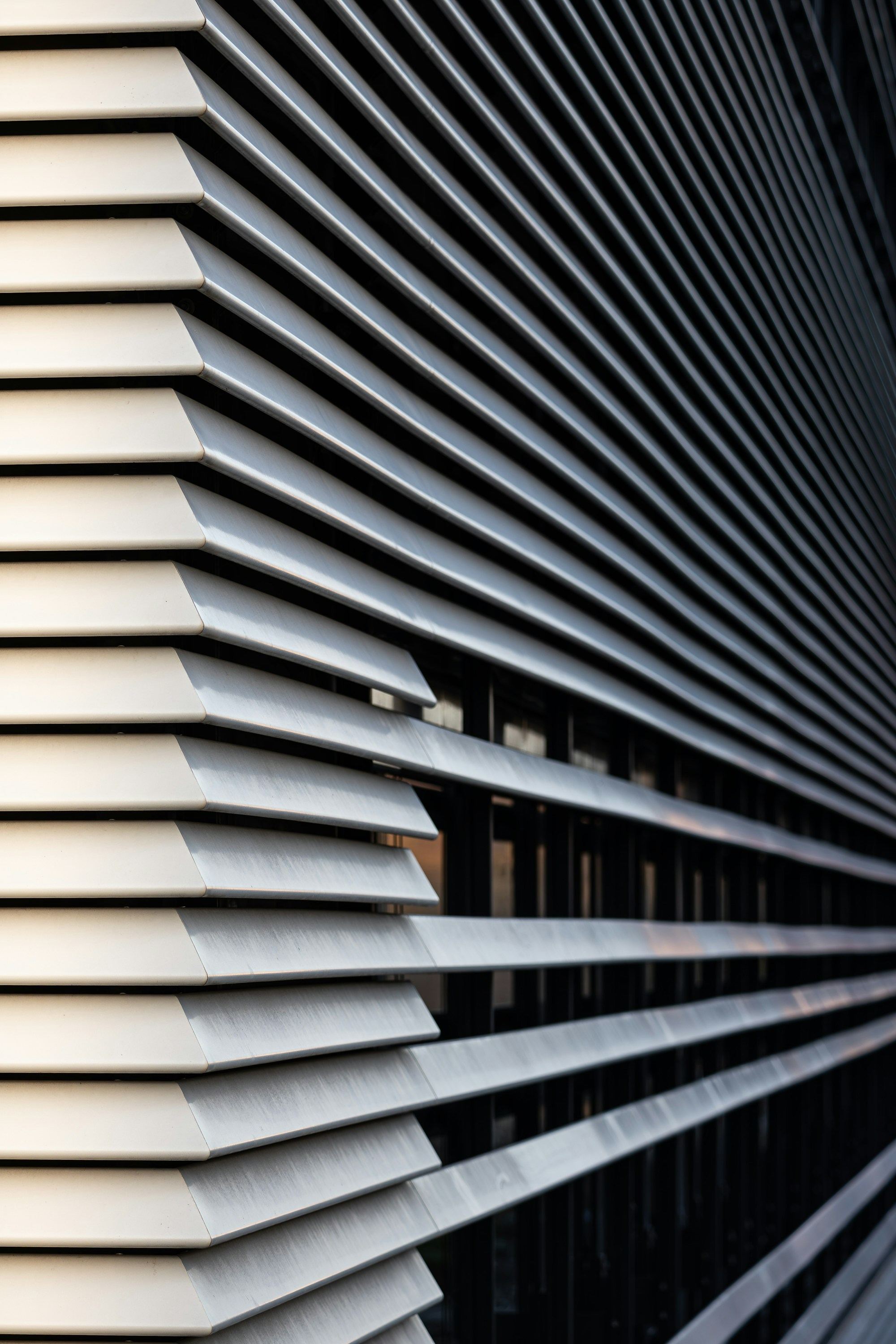 A building face lined with deep horizontal louvre blades.