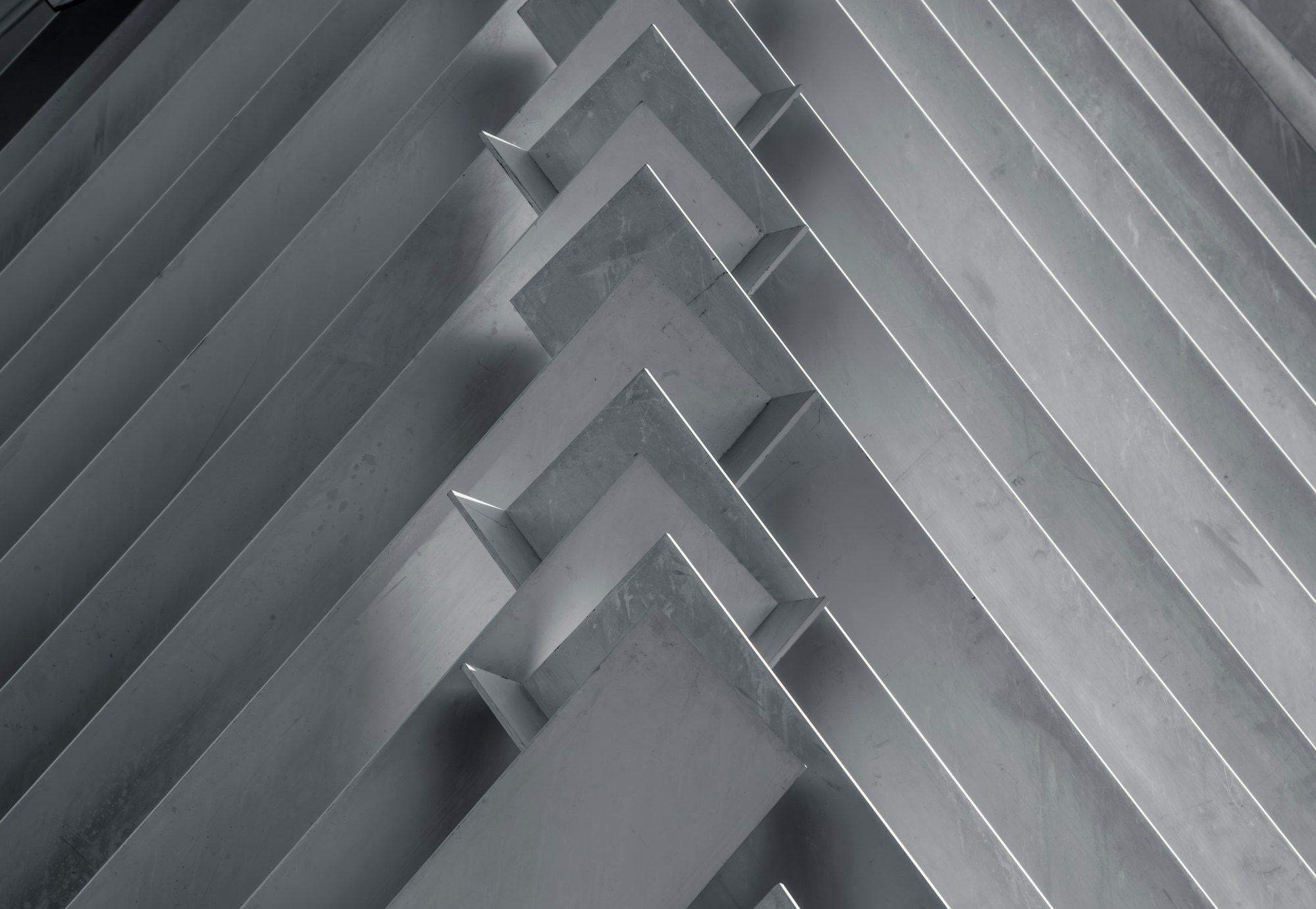 Folded aluminium sheets stacked in overlapping layers.