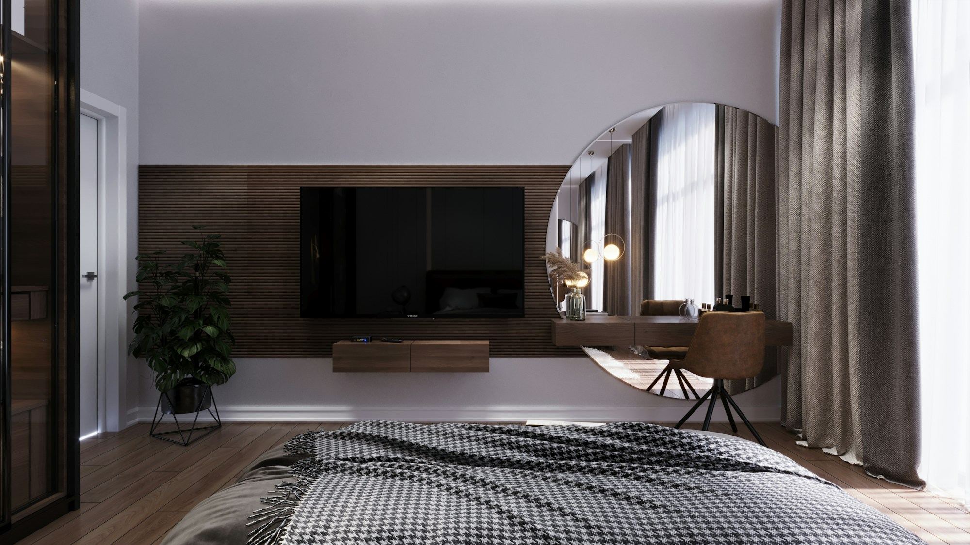 A bedroom with a large mirror set into the wall beside the bed.